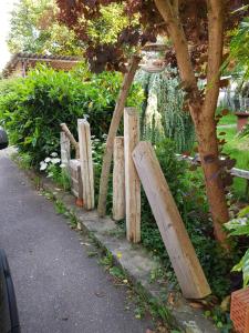 a wooden fence on the side of a road at Ferienwohnung Namaste in Langenargen