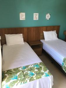 two beds sitting next to each other in a room at Praia de Itacimirim - Praia da Espera in Itacimirim +40 photos