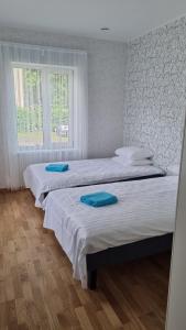 Postel nebo postele na pokoji v ubytování Kivi Residence