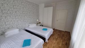 Postel nebo postele na pokoji v ubytování Kivi Residence