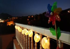 a row of lights on a balcony at night at CASA TAYRI DE TAMAIDE TENERIFE SUR in San Miguel de Abona