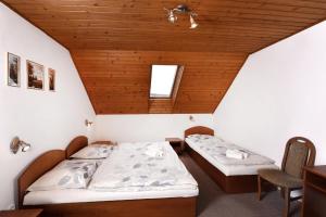 Postel nebo postele na pokoji v ubytování Penzión Perla-Aqua
