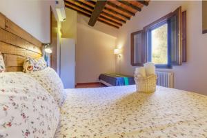 a bedroom with a bed and a window at Vicolo dell'Inferno in San Miniato