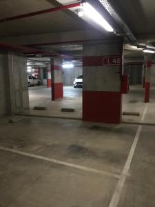 an empty parking garage with a car parked in it at Depto en Complejo Ciudad Gama in Cordoba