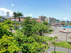 a city with a park with trees and buildings at Yxelatam Appartements de luxe vue mer mémorial act Pointe-à-Pitre in Pointe-à-Pitre
