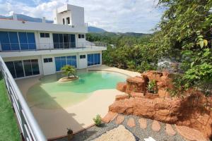 an image of a house with a swimming pool at Quinta SHADDAI MELGAR in Melgar +19 photos