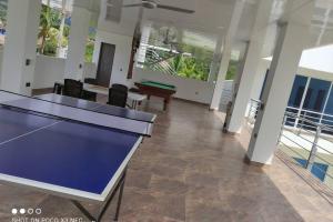 a room with a ping pong table in it at Quinta SHADDAI MELGAR in Melgar