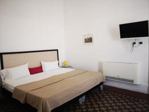 Postel nebo postele na pokoji v ubytování Hotel Valentino