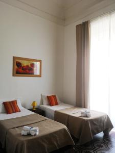 Postel nebo postele na pokoji v ubytování Hotel Valentino