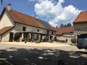 a large white building with a roof at Maison d’izier in Izier
