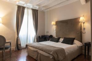 Postel nebo postele na pokoji v ubytování Hotel Clitunno