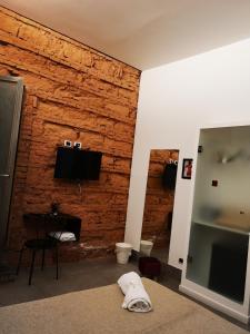 TV a/nebo společenská místnost v ubytování Hotel Valentino