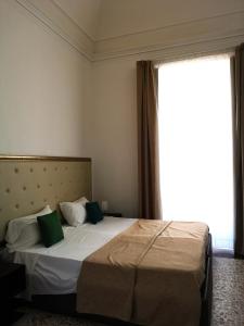 Postel nebo postele na pokoji v ubytování Hotel Valentino