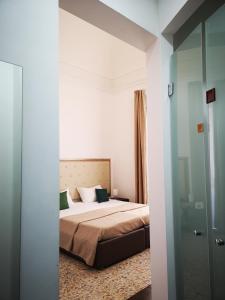 Postel nebo postele na pokoji v ubytování Hotel Valentino