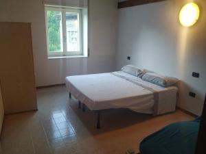 Postel nebo postele na pokoji v ubytování Agriturismo Val di Ferro