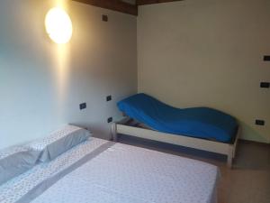 Postel nebo postele na pokoji v ubytování Agriturismo Val di Ferro