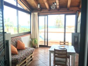 a living room with a couch and a table at Panorama sul Mare in Noto Marina +24 photos