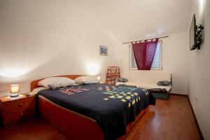 Una cama o camas en una habitación de Apartments Madirazza