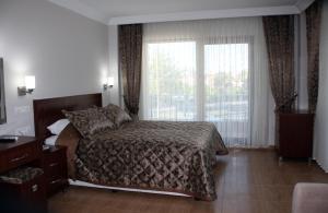 Postel nebo postele na pokoji v ubytování Keyf Konak Boutique Hotel