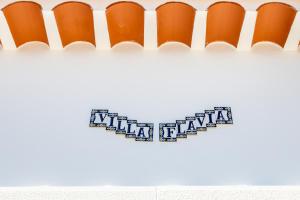 a sign on a wall with the word aliya fluja on it at Villa Flavia in Aljezur