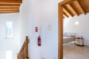 a staircase leading to a bedroom in a house at Villa Flavia in Aljezur