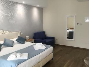 Postel nebo postele na pokoji v ubytování CAVALIERE suite & rooms