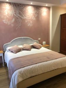 Postel nebo postele na pokoji v ubytování CAVALIERE suite & rooms