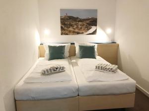 Postel nebo postele na pokoji v ubytování Haus Frisia Bungalow Frisia 1