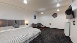 Postel nebo postele na pokoji v ubytování WooW Apartments