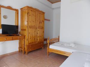 Postel nebo postele na pokoji v ubytování Hotel Sgouridis