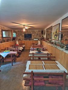 a row of tables in a room with a unintention at Apartments Vejo in Korčula