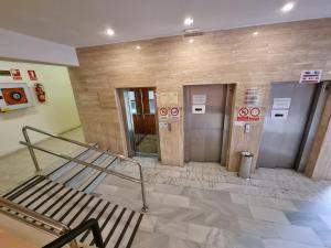 a waiting room with two elevators in a building at Ocean View Apartment, Costa Adeje,Tenerife in Adeje