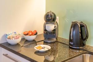 a coffee maker sitting on top of a counter at Haus Darioli in Zermatt