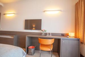 Televiisor ja/või meelelahutuskeskus majutusasutuses Hotel Monaco Zeebrugge Beach by Rikas Hotels