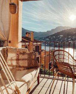 a porch with a couch and chairs on a balcony at Casa Vista Bonita in Port de Soller