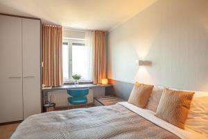 Voodi või voodid majutusasutuse Hotel Monaco Zeebrugge Beach by Rikas Hotels toas
