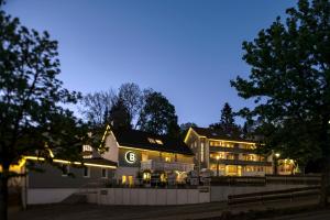 a large building with lights on it at night at Berg und Tal Hotel & Apartments in Braunlage
