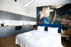 Łóżko lub łóżka w pokoju w obiekcie Aparthotel Inspire Miodova Residence