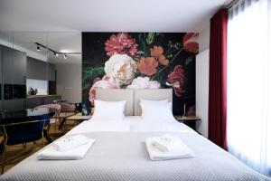Łóżko lub łóżka w pokoju w obiekcie Aparthotel Inspire Miodova Residence