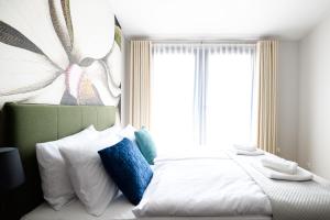 Łóżko lub łóżka w pokoju w obiekcie Aparthotel Inspire Miodova Residence
