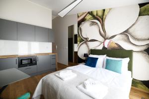 Łóżko lub łóżka w pokoju w obiekcie Aparthotel Inspire Miodova Residence