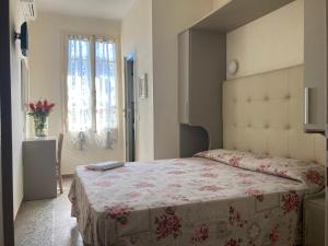 Postel nebo postele na pokoji v ubytování Hotel Verdesolemare