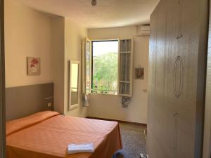 Postel nebo postele na pokoji v ubytování Hotel Verdesolemare