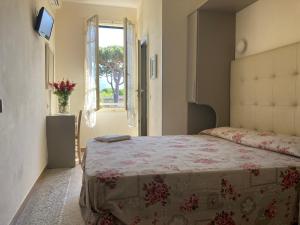 Postel nebo postele na pokoji v ubytování Hotel Verdesolemare