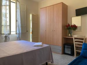 Postel nebo postele na pokoji v ubytování Hotel Verdesolemare