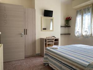 Postel nebo postele na pokoji v ubytování Hotel Verdesolemare