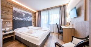 Cama o camas de una habitación en Parc Hotel Miramonti