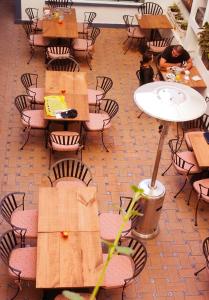 an overhead view of a restaurant with tables and chairs at Blue Bicycle House in Querétaro