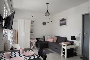 a living room with a couch and a table at U Kostków in Dziwnówek