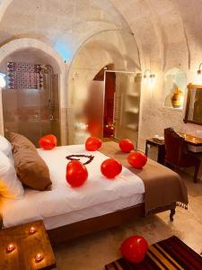 A bed or beds in a room at Zuwinasa House Hotel
